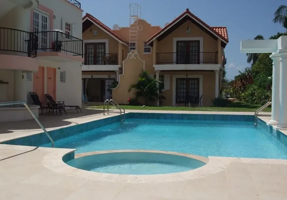 Communal swimming pool and tropical gardens at 7 Springcourt, Barbados.