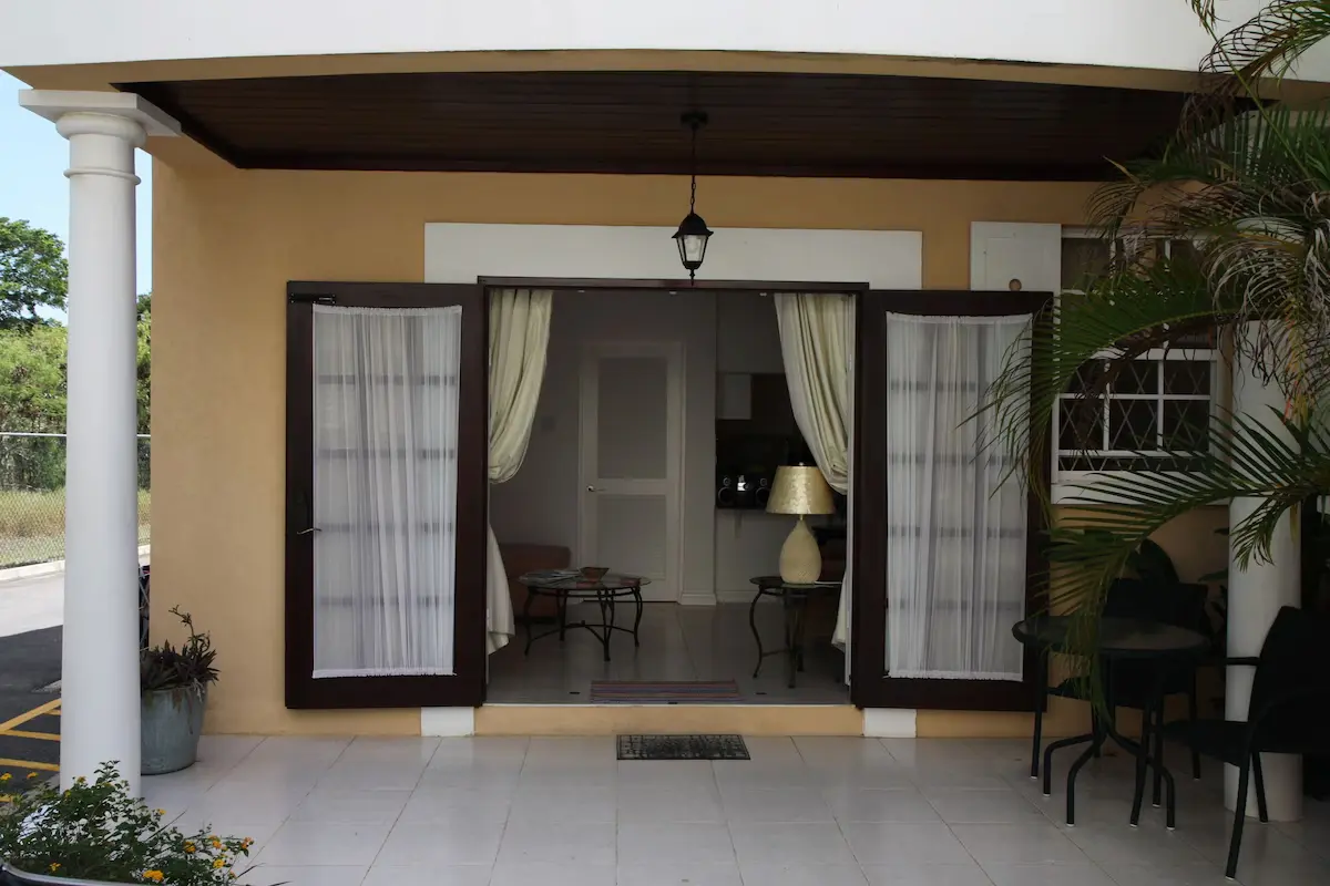 Open patio doors leading into the ground-floor lounge at 7 Springcourt.