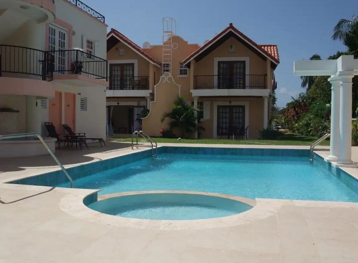 Patio and tropical gardens at 7 Springcourt, Rockley, Barbados.