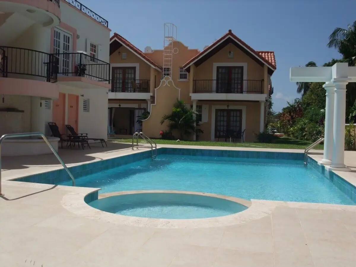 The shared pool and tropical courtyard at 7 Springcourt, Rockley, Barbados.